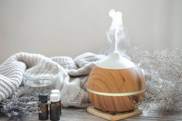 istock Composition with an air humidifier and a set of aromatic oils. 1303477863