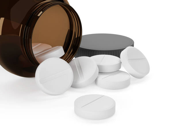 istock pharmacy bottle with round pills isolated on white 1303478068