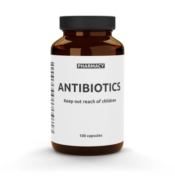 istock Antibiotic pills bottle isolated on white background 1303478443