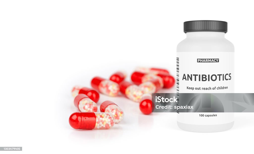 Pharmacy bottle with red pills isolated on a white Pharmacy bottle with red pills isolated on a white background. 3d illustration Antibiotic Stock Photo
