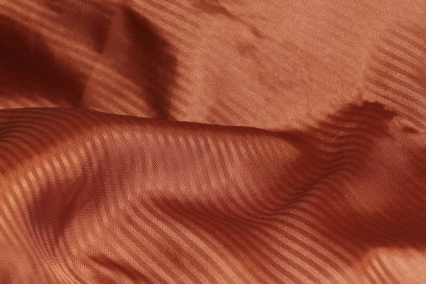 istock Orange Abstract background. Orange Synthetic fabric texture, background. Orange fabric. 1303480232