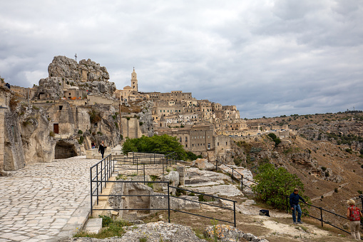 Matera, Italy - September 20, 2019: View of the Sassi di Matera a historic district in the city of Matera, well-known for their ancient cave dwellings. Basilicata. Italy