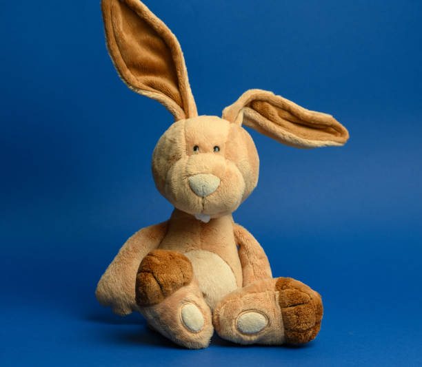 pink plush rabbit with carrot, isolate, festive easter rabbit