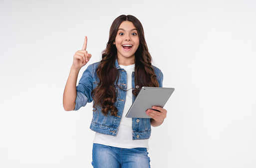 Smart young caucasian girl having an idea holding tablet isolated in white background