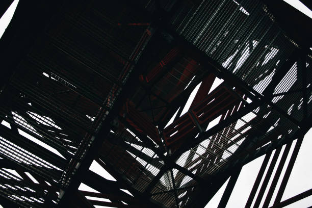 istock Close up view on observation tower construction elements, wooden tower in forest, wooden stairs 1303483748