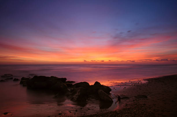 istock Sunset at the beach, long exposure shot 1303484669