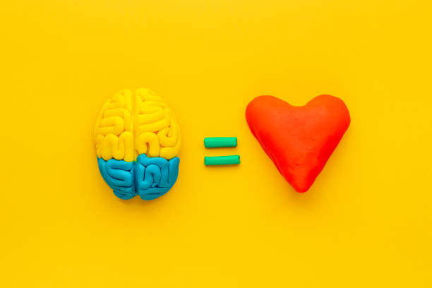 istock Think with love - heart and brain concept, top view 1303485620