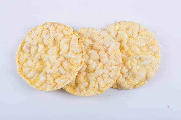 istock A yellow flat round galettes on white background. 1303488358