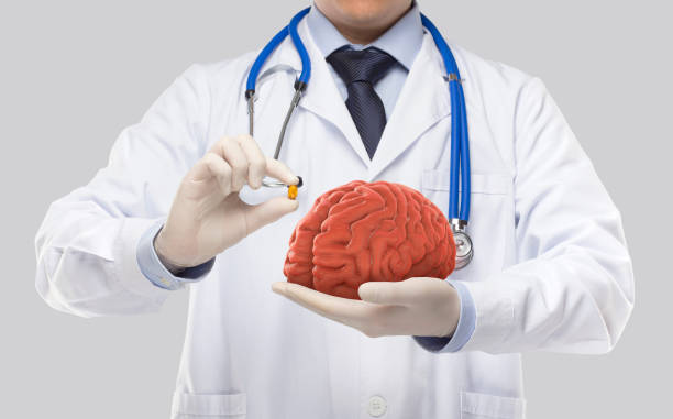 istock doctor holding brain and tonic 1303488501