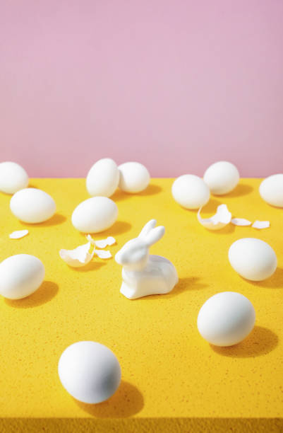 istock Easter minimal composition with white eggs and a bunny, blank space for a greeting text 1303488859