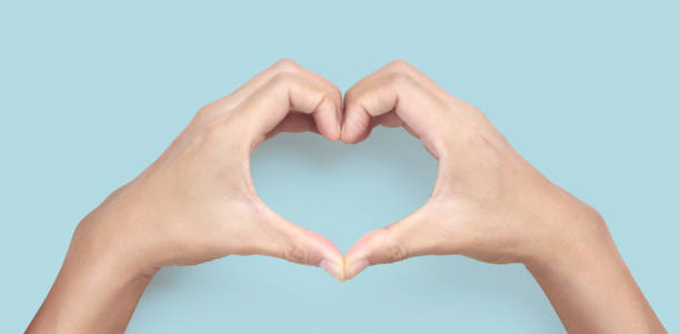 istock Hands making sign Heart isolated. Beautiful hands  with copy space 1303491294