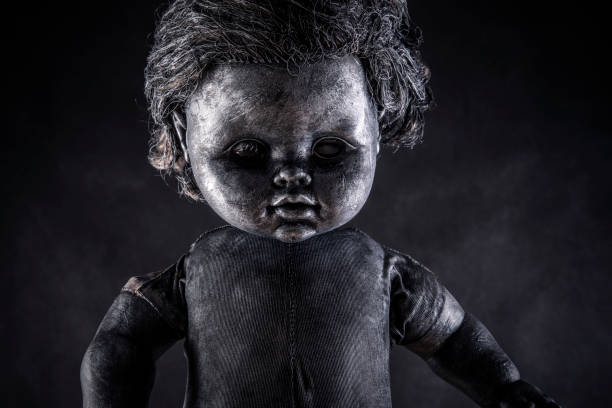 istock Creepy doll in the dark 1303495813
