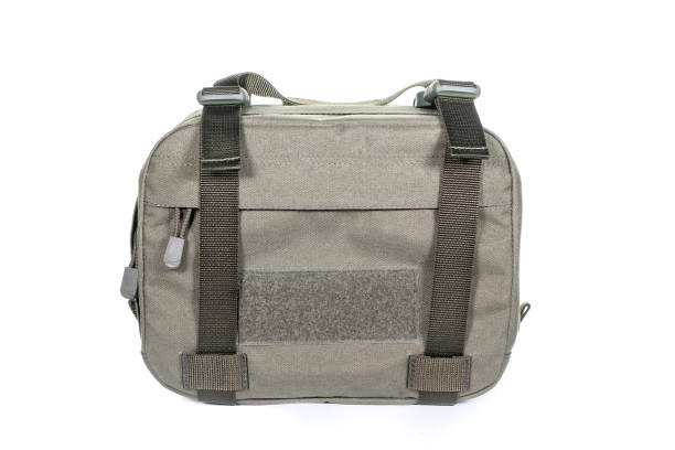 istock Green Canvas Backpack Isolated on White. Front View of Modern Waterproof Camping Traveler Back Pack Bag with Shoulder Straps and Haul Loop. Tactical Hiking Backpack For Travel Travel for Men 1303497408