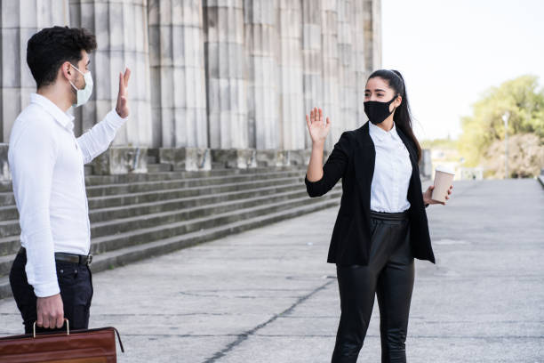 istock Business people keeping social distance. 1303497782
