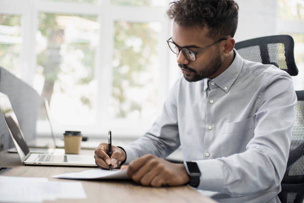 istock Business man signing document agreement 1303498206