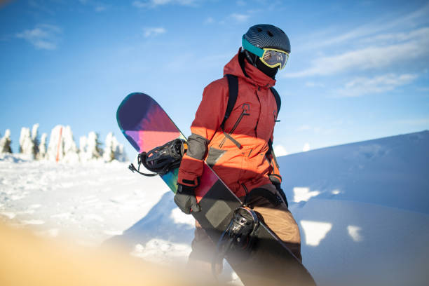 istock Snowboarder enjoying nature on the snowy mountain 1303498289