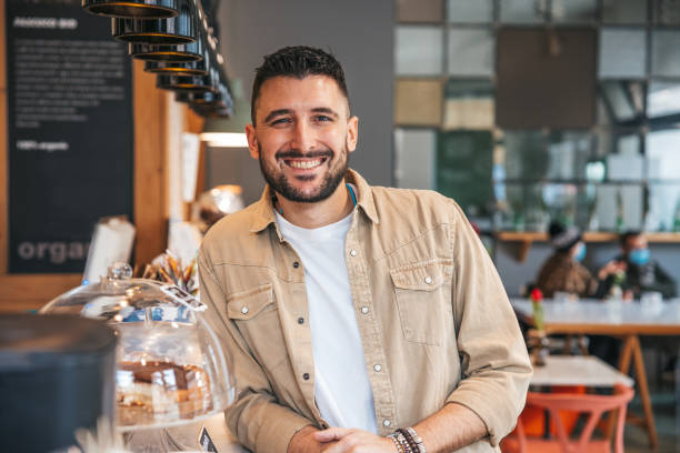 istock Portrait of a millennial smiling man 1303498955
