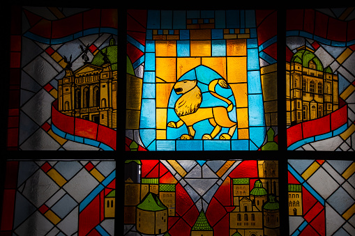 Lviv, Ukraine - February 21, 2021: stained glass window with Lviv coat of arms in Lviv city hall