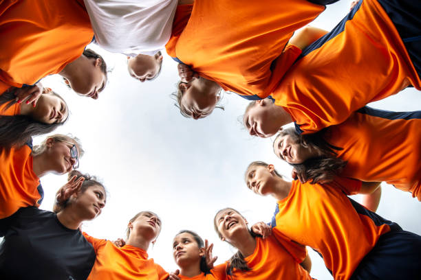 istock Low angle view of female soccer team 1303499270