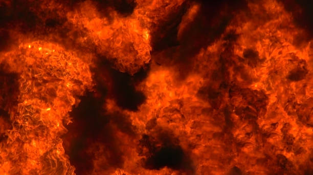 istock Background is a swirling wall of explosive fire. 1303499378
