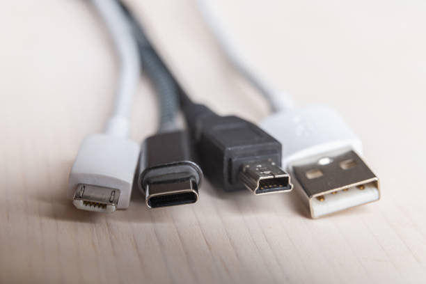 istock Smartphone with mini usb, micro usb, usb type c plugs; plugs to connect charge the phone. 1303499701