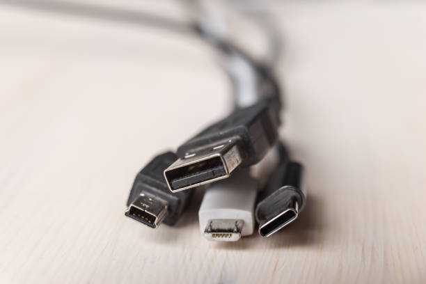 istock Smartphone with mini usb, micro usb, usb type c plugs; plugs to connect charge the phone. 1303500472