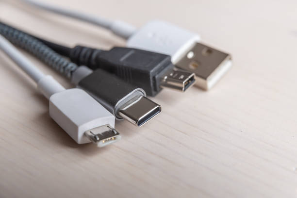 istock Smartphone with mini usb, micro usb, usb type c plugs; plugs to connect charge the phone. 1303500518