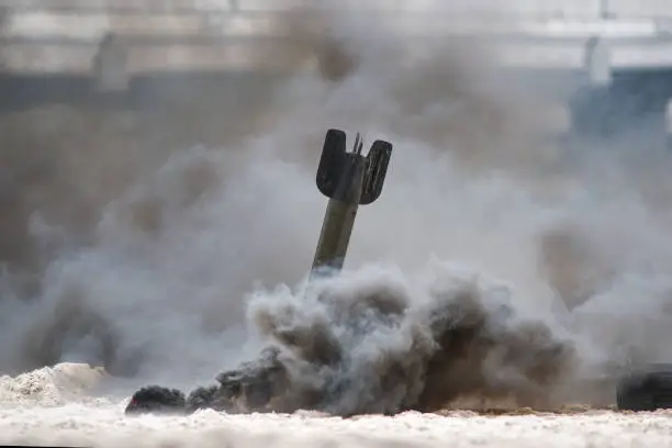 Photo of Bomb exploding on the beach, historical reconstruction.