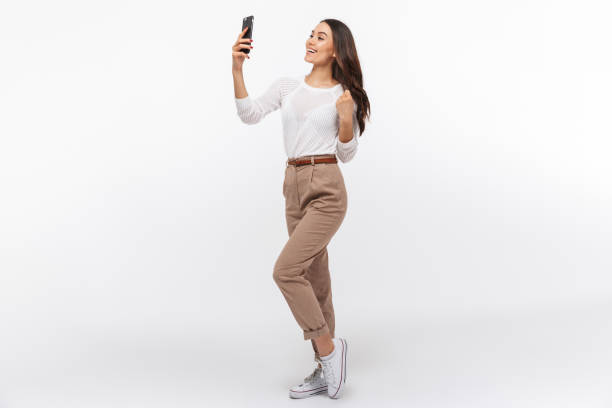 Full length portrait of a smiling asian businesswoman stock photo