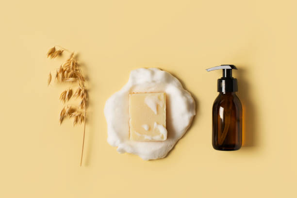 istock Liquid and bar natural eco soap lat lay on yellow background 1303504087