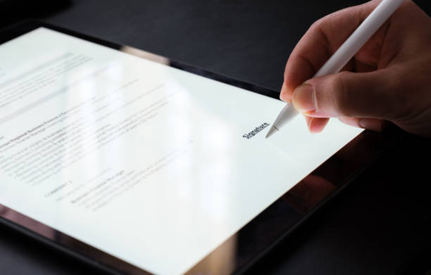 istock Businessman Signing Electronic Contract On Digital Tablet 1303505851