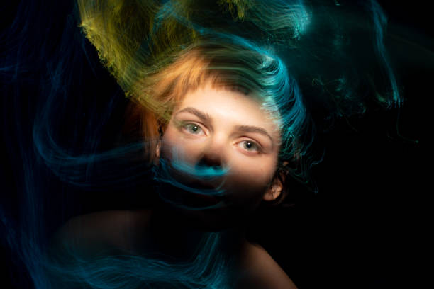 istock light painting portrait 1303507006