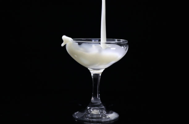 istock White drink splash into the glass 1303508341