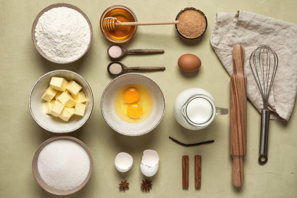 istock Baking ingredients on a beige concrete background. View from above. 1303510056