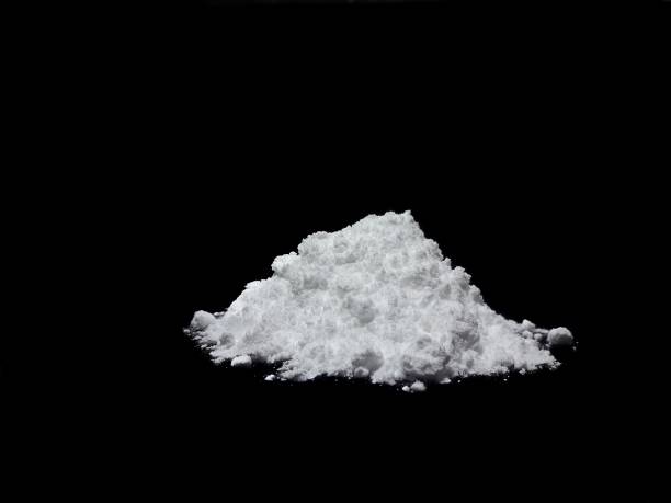 istock Cocaine drug powder on black background 1303512943