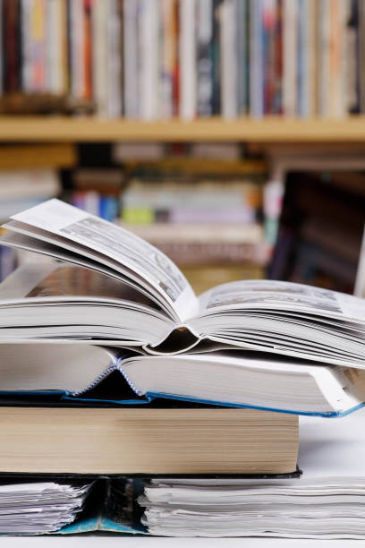istock Open books close up at the library 1303515545