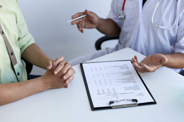 istock The doctor is explaining the treatment after examining the patient. 1303515601