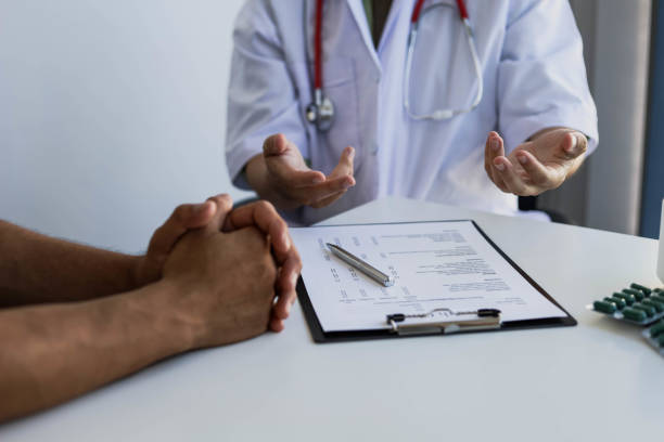 istock The doctor is explaining the treatment after examining the patient. 1303515942