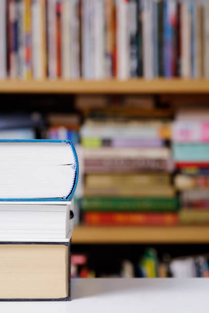 istock Stack of books close up at the library 1303516018
