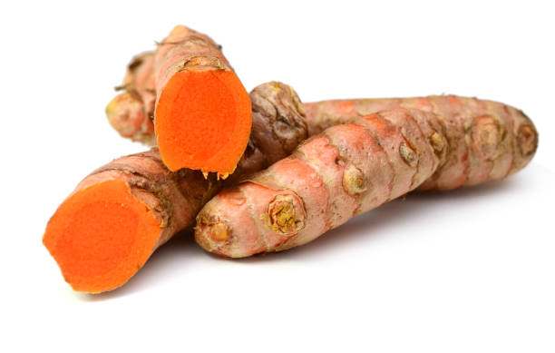 istock Group of turmeric roots, isolated on white background 1303518612