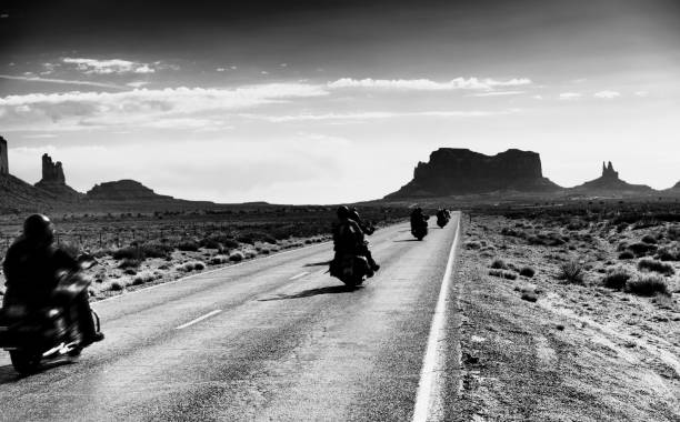 istock Bikers Driving in Monument Valley. 1303519003