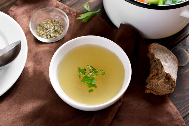 istock Chicken broth with vegetables and spices 1303521472