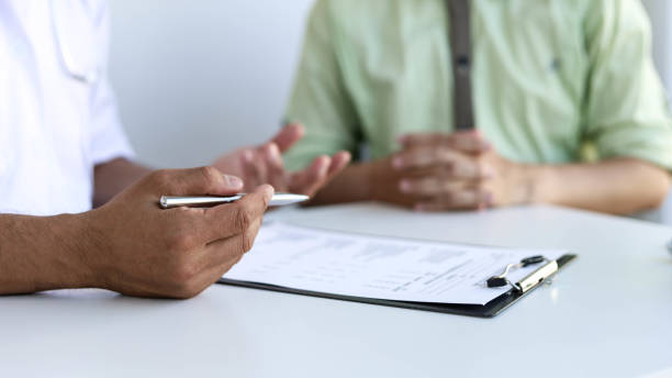 istock The doctor is explaining the treatment after examining the patient. 1303523018