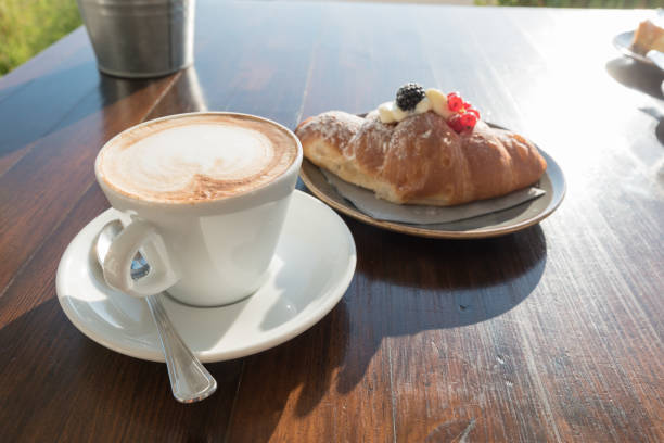 istock Breakfast at the beach with pasta and capuccino 1303525233