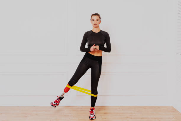 istock Beautiful woman with prosthesis leg 1303527207