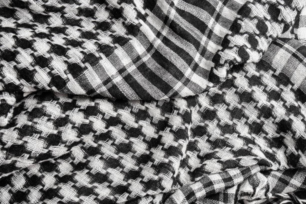 istock black and white arabic scarf background 1303530293