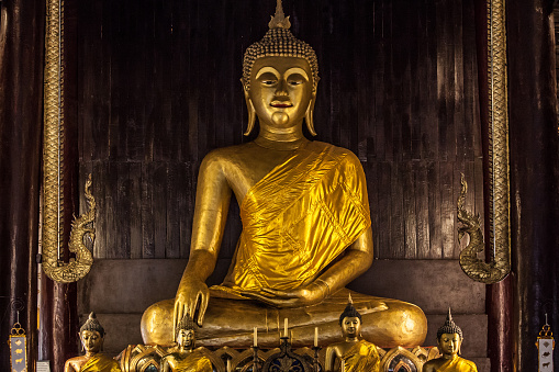 Sitting Buddha at Wat Phan Tao, Chiang Mai, Thailand.