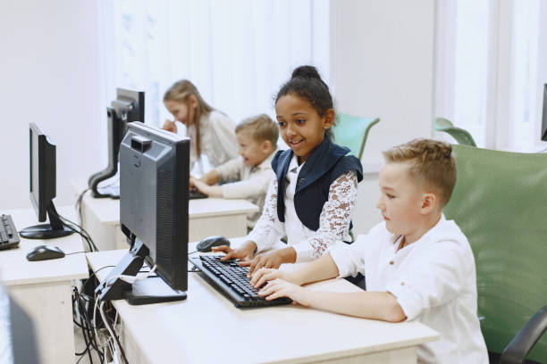istock Children sit at computers in the classroom. 1303532434