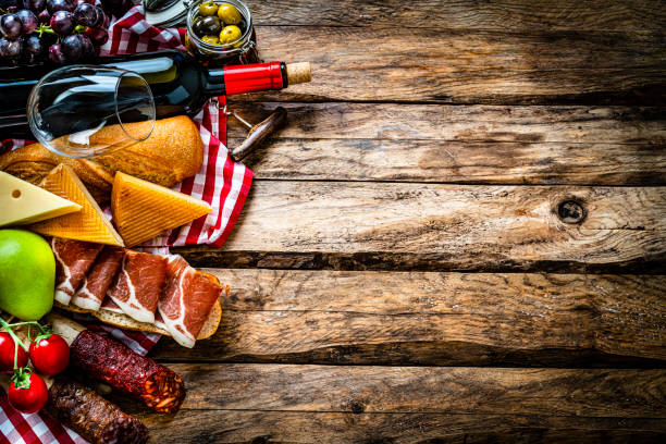 istock Mediterranean food: Iberico ham sandwich, cheese and red wine on wooden table 1303532486