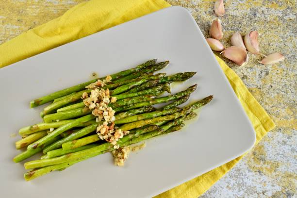 istock Roasted green asparagus with garlic 1303532694